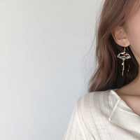 Boucles d'oreilles éventail japonais portées femme oreilles
